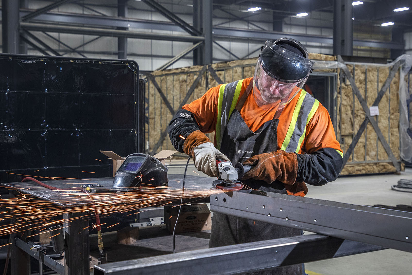 A worker welding metal