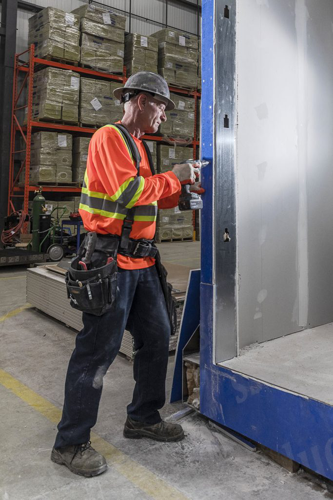 A person working with construction elements.