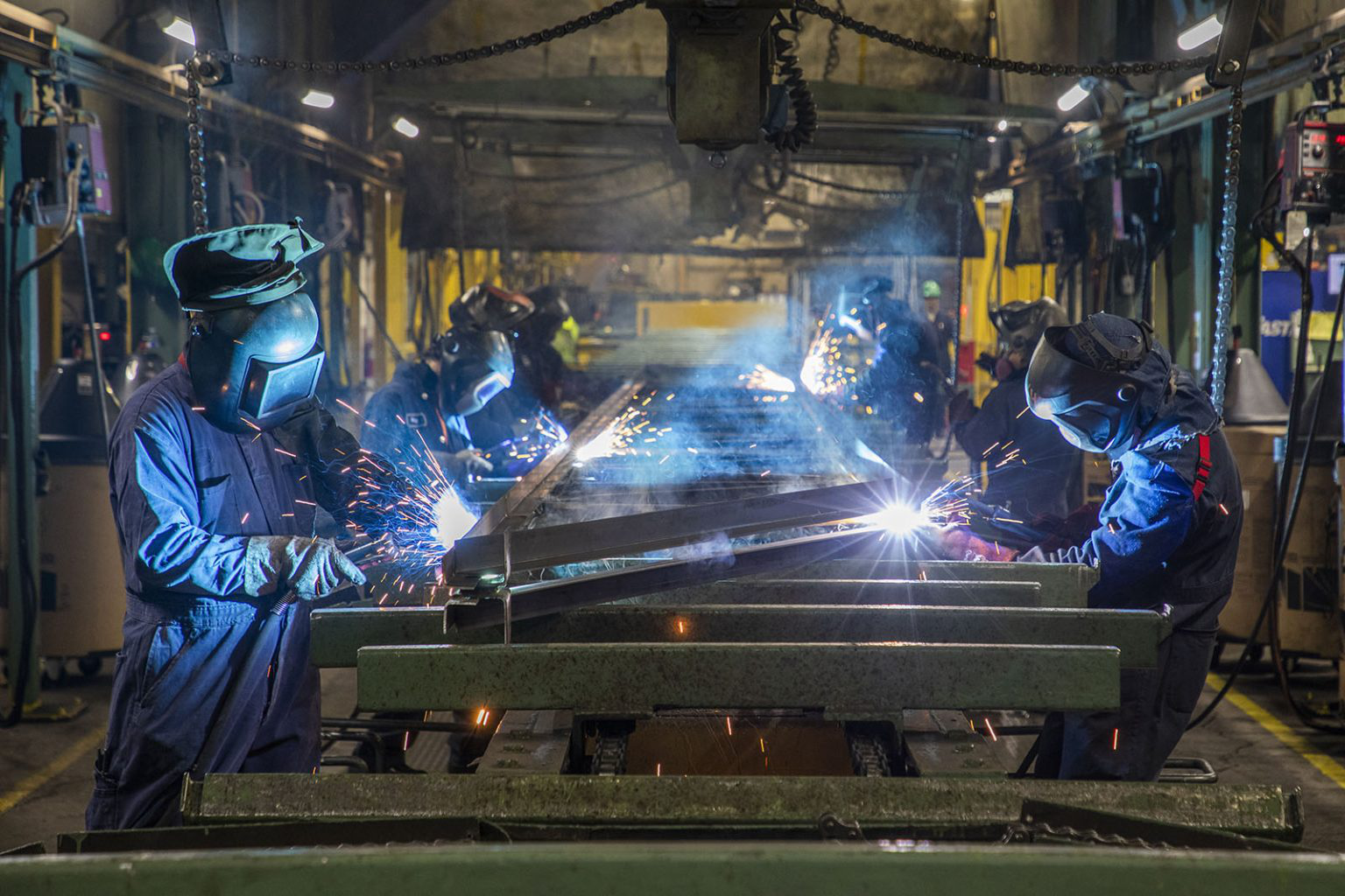 Several people working with construction elements.