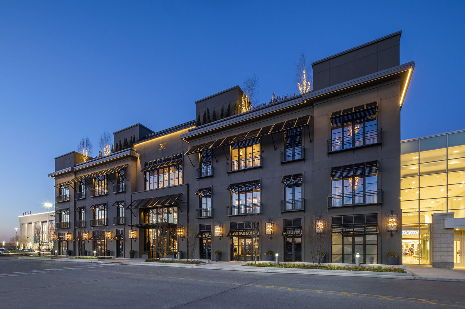 A large commercial building with high quality professional lighting.