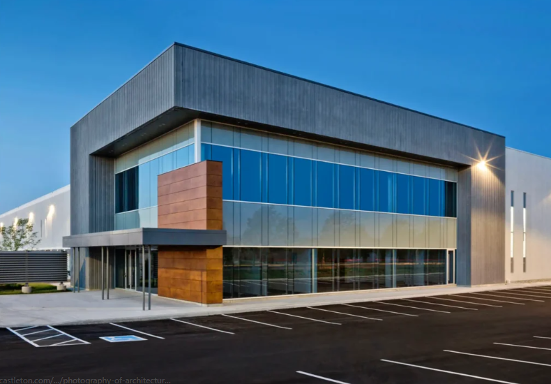 A large commercial building on a modern street.