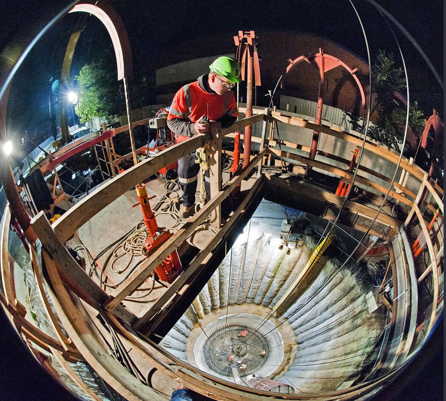  Perspective shot of a construction site with a worker observing placement.