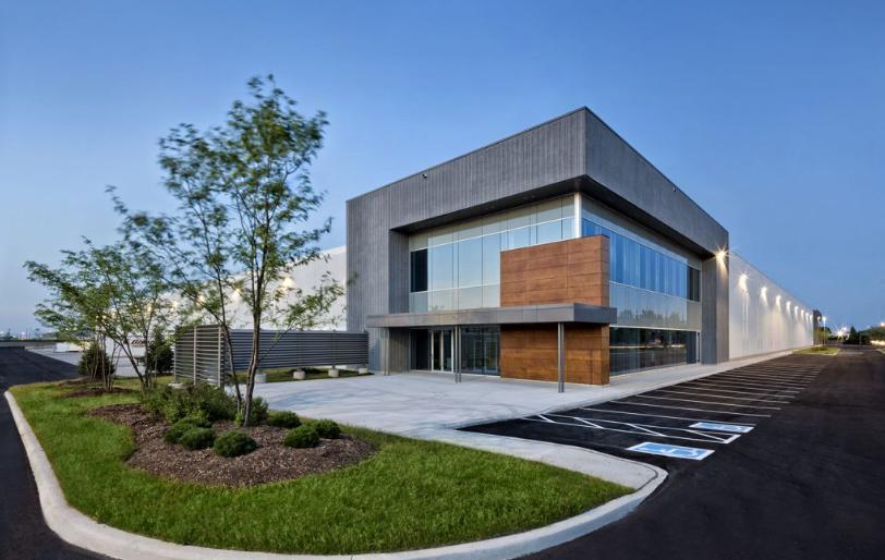 A large building exterior with a lawn.