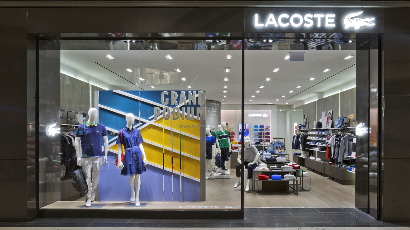 Bright window lighting and a bold seasonal display show what retail storefront photography can do to stop foot traffic before a customer ever steps inside.