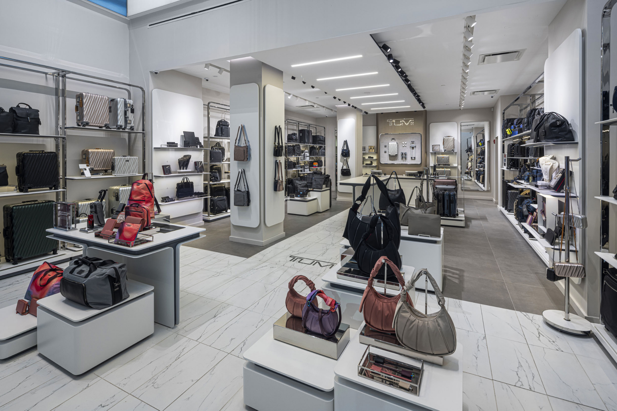 Layered product staging and bright, even lighting in this retail storefront photography shot let every display case read clearly.