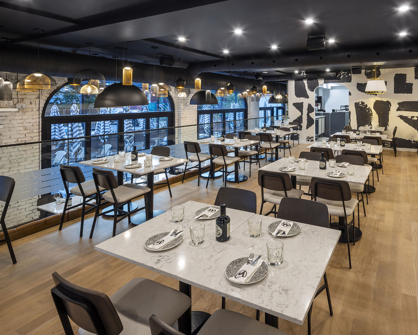 A close, table-level angle turns hospitality photography into a preview of the dining experience itself, down to the place settings.
